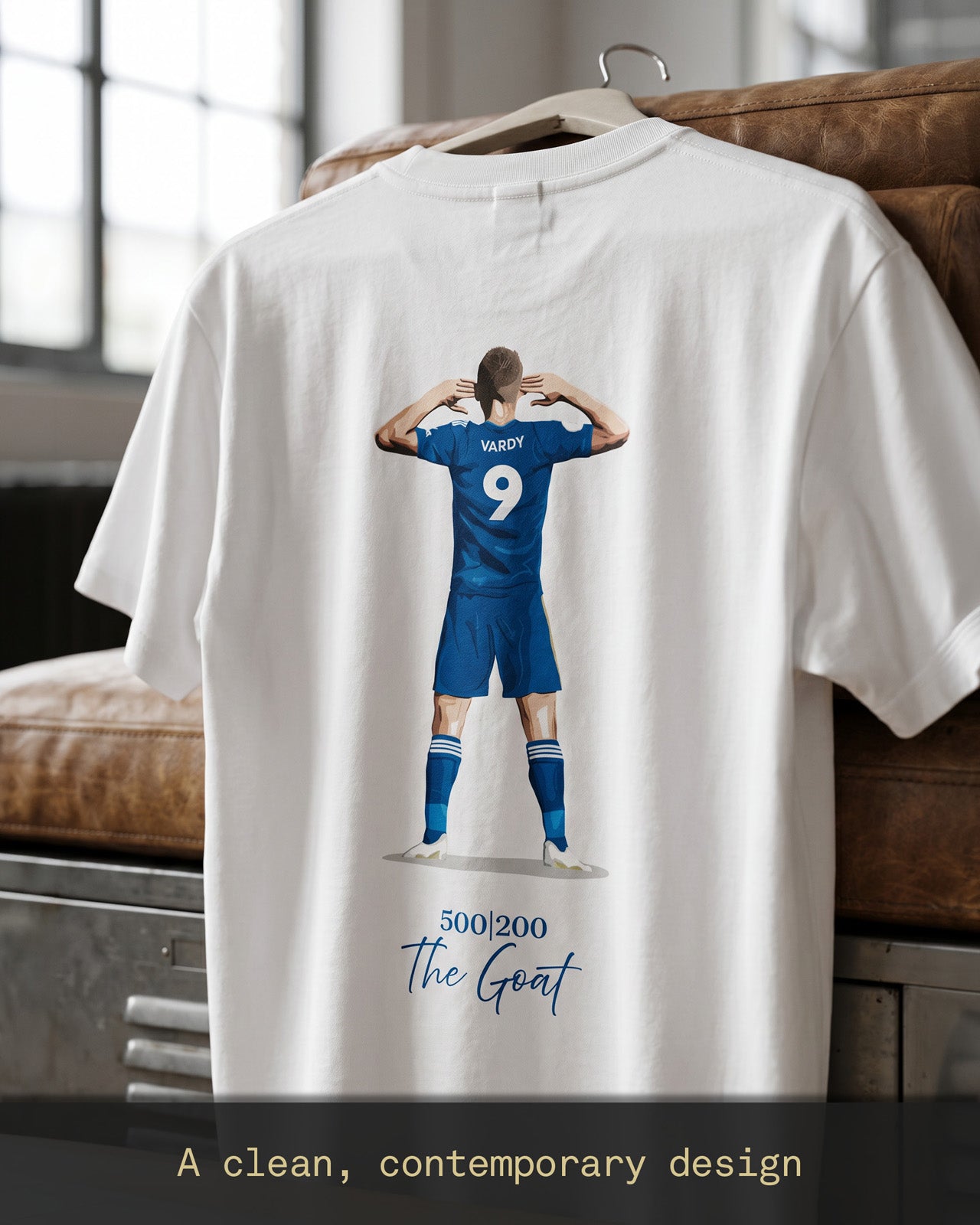 Jamie Vardy 500 Appearances 200 Goals Legacy T-shirt hanging on display, featuring the iconic back illustration and ‘The Goat’ graphic celebrating a Leicester City legend.