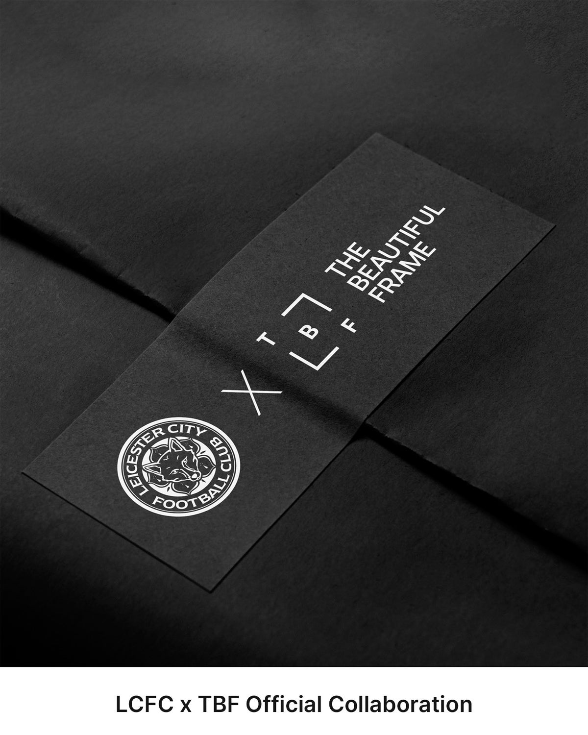 Black presentation packaging with a Leicester City FC x The Beautiful Frame collaboration band.